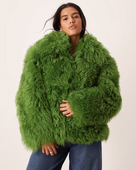A model wearing a fluffy green jacket