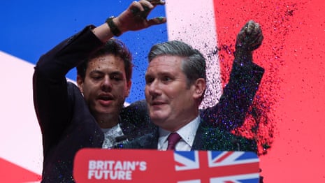 Protester pours glitter over Keir Starmer during Labour conference speech – video | Keir Starmer | The Guardian
