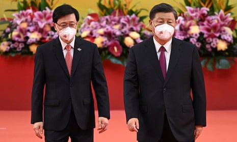 Hong Kong's new chief executive, John Lee (left), with the Chinese president, Xi Jinping, after a swearing-in ceremony in Hong Kong.