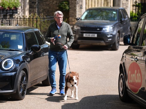 Peter Mandelson taking his dog for a walk.