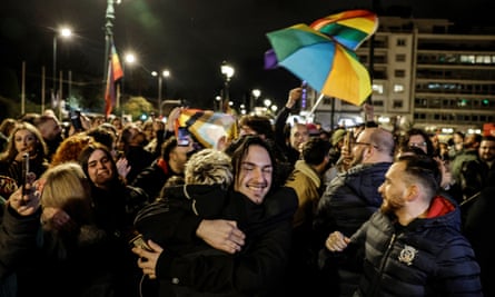 People celebrate in front of Greek parliament