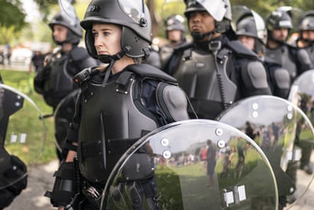 Police in riot gear observe the Justice for J6 rally near the US Capitol in Washington DC on Saturday.
