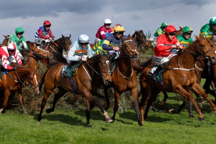 Horses clear the Chair during the Grand National at Aintree