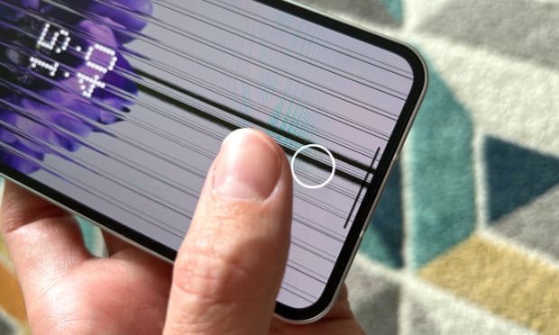 An image showing the fingerprint scanner lighting up beneath the screen of the Nothing Phone 1.