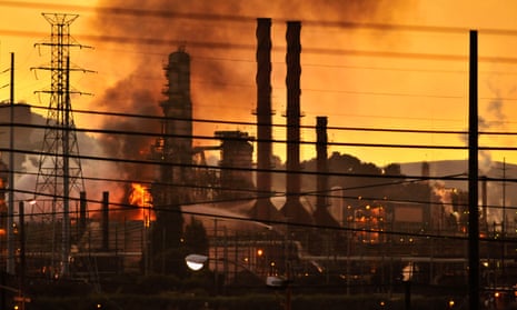 Firefighters douse flames at the Chevron oil refinery in in Richmond, California, in August 2012.