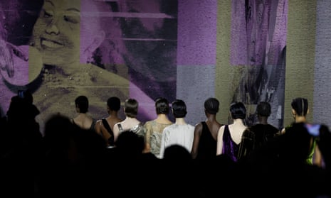 Models walk past artwork depicting Josephine Baker by artist Mickalene Thoma at Dior’s Haute Couture Spring/Summer 2023 show at Paris Fashion Week.