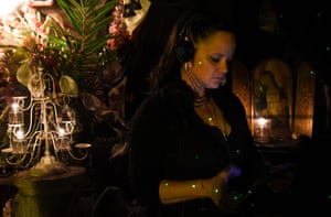 Brigid Goode, a paranormal investigator, is illuminated by a green laser grid used to detect possible spirits. Brigid Goode, a paranormal investigator, is illuminated by a green laser grid used to detect possible spirits.