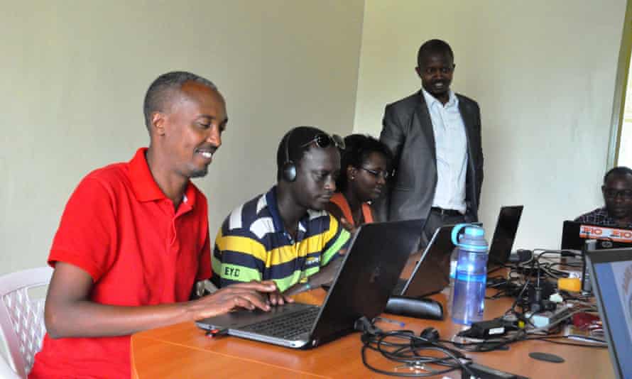 Jean Baptiste Bireha, left, in the Radio Inzamba newsroom in Kigali.