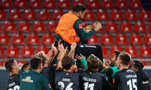 Claudio Pizarro is hoisted in the air by his Werder Bremen teammates after his final game for the club.