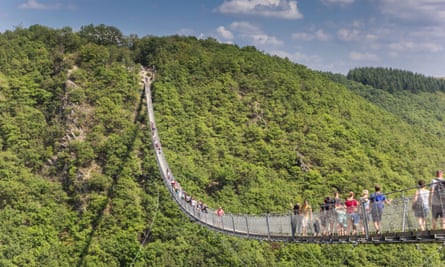 Tourists enjoying the view on the Geierlay suspension bridge.