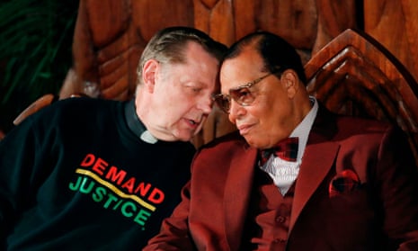 Father Michael Pfleger talks with Nation of Islam leader Louis Farrakhan at St Sabina Catholic Church in Chicago.
