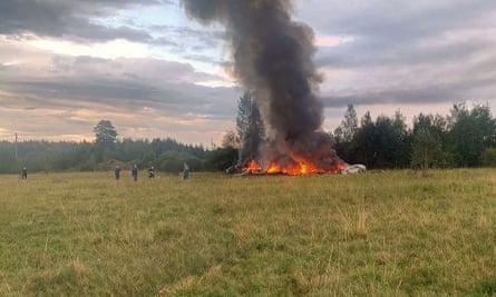 A still image posted on a Wagner linked Telegram channel showing rescuers at work at the site of the plane crash near.