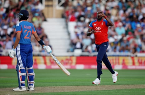 England's Jofra Archer celebrates after taking the wicket of India's Axar Patel caught out by England's Jos Buttler.