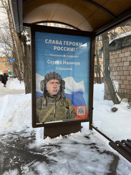 A poster depicting a Russian soldier, named as Sergey Ivanchuk, at a bus stop in Moscow under the caption ‘Glory to Russia’s heroes’.