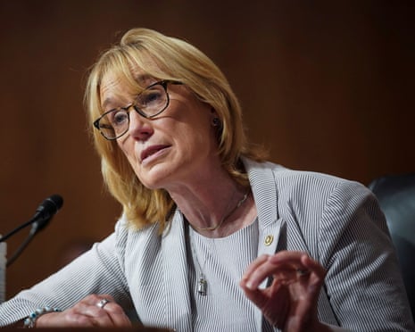 Senator Maggie Hassan gestures while speaking into a microphone during a hearing