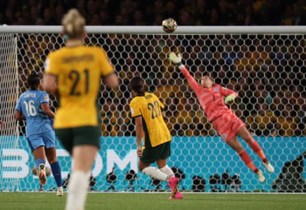 Mary Earps jumps for the ball as it goes into goal above her head