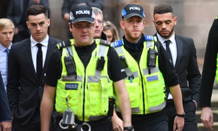 Tom Lawrence (far left) and Mason Bennett are escorted by police from Derby magistrates court in October 2019.