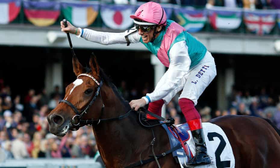 Frankie Dettori celebrates aboard Enable after getting past Aidan O’Brien’s Magical in the final furlong.