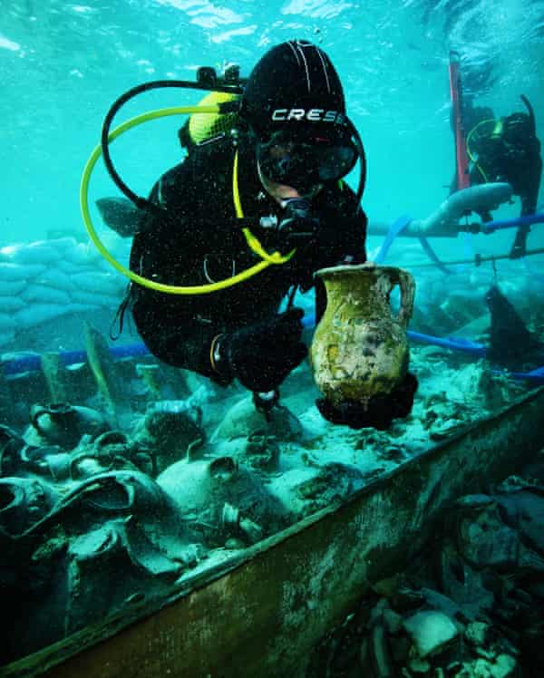The diver inspects the finds