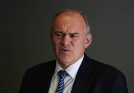 Ed Davey looking pensive in shirt and tie