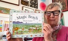 Author and illustrator Alison Lester holds her classic children's picture book Magic Beach.
