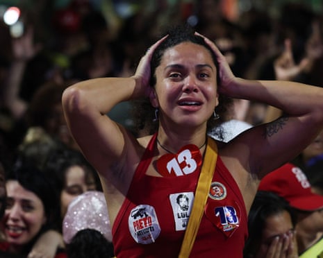 A Lula supporter reacts to the vote count news