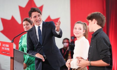 Canada’s PM Justin Trudeau thanks two of his children, Ella-Grace and Xavier, during the Liberal election night party in Montreal.