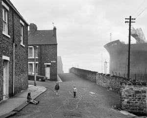 Girls Playing in the street, Wallsend, Tyneside,1976Against a background of shipbuilding and coal mining, he witnessed the togetherness of communities and the industries that sustained them. He also stayed long enough to see their loss