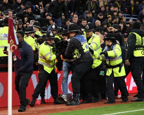 One Young Boys fan is led away.
