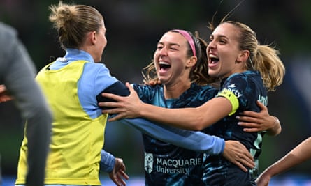Shea Connors celebrates her grand final-winning goal with her young Sydney FC teammates.