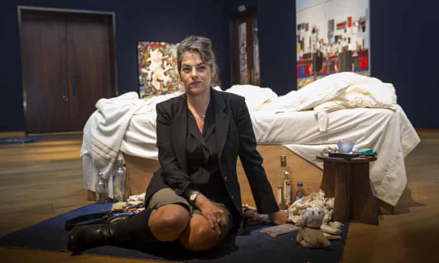 Dirtied by love and life … Tracey Emin with her most famous work, 1998’s My Bed.