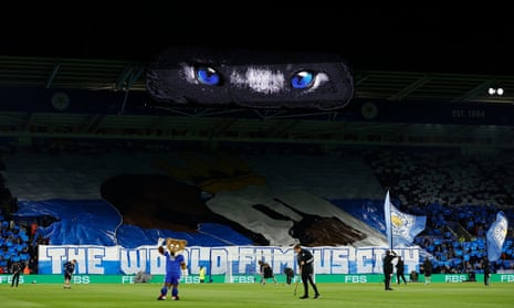 Leicester City mascot Filbert Fox waves to the fans after a large banner is unfurled in the stand.