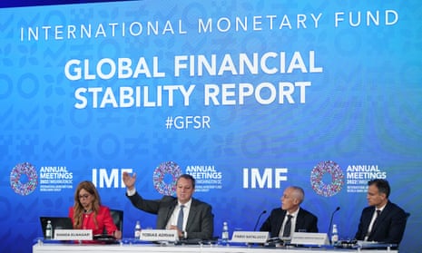 Tobias Adrian, second from left, speaking at a news conference on the IMF's Global Financial Stability Report