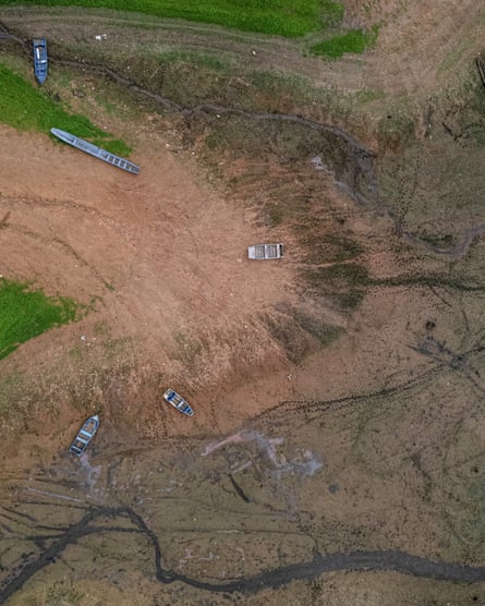 Aerial view of boats stranded on the dried bed of Lake Alhajuela, Panama