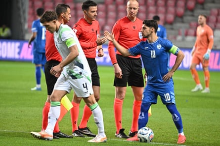 Republic of Ireland captain Dara O'Shea (left) turns away from Israel captain Manor Solomon before kick-off.