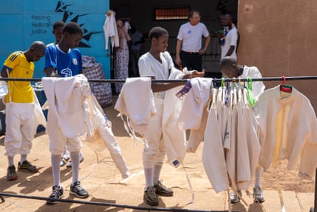 Youngsters hang up their white fencing jackets