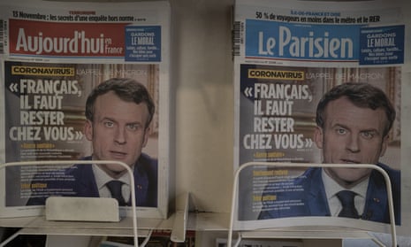 Front pages of two newspapers showing Emmanuel Macron telling French citizens to stay at home