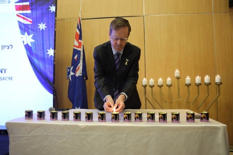 Israel’s president, Isaac Herzog, lights a memorial candle at an event in Jerusalem commemorating the victims of the Bondi shooting in December 2025.