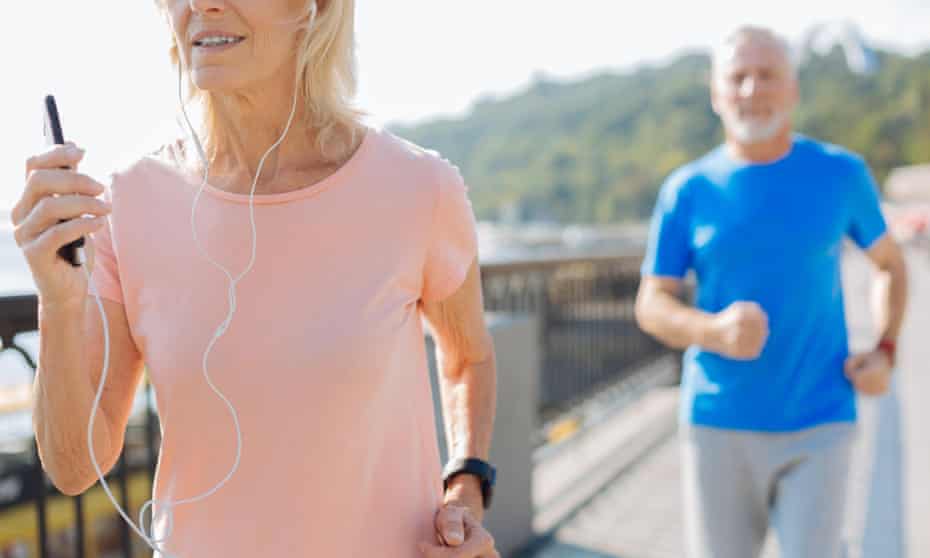 Woman listening to music and running