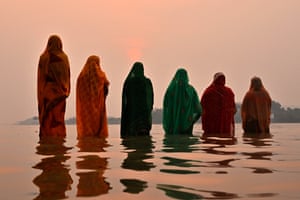 Hindu devotees ankle deep in the river Brahmaputra