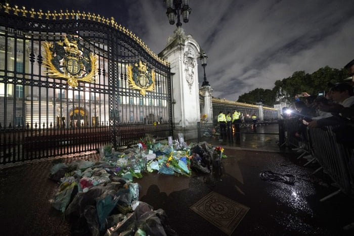 Floral tributes left outside Buckingham Palace on Thursday evening.
