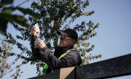 A volunteer tests the quality of water from the River Severn.