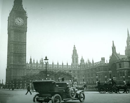 Parliament Square, London, circa 1906, showing early electric lamps, an automobile and a horse-drawn carriage or cart.