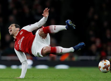 Arsenal’s Henrikh Mkhitaryan goes flying after being clattered into by CSKA Moscow’s Georgi Schennikov.