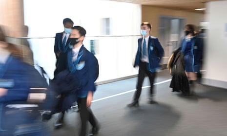 Students wearing masks as they move between classrooms in March.