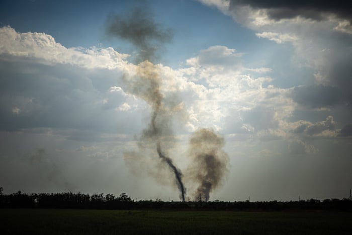 Smoke rises at the front line near Mykolaiv in southern Ukraine.