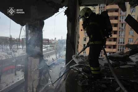 A Ukrainian firefighter extinguishes a fire.