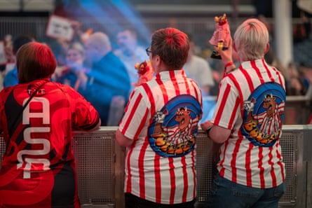 Darts fans with shirts showing the logo of the TV show Bullseye