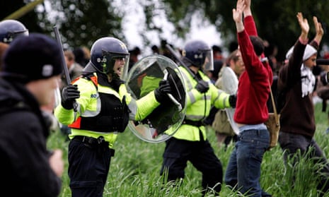 Police clash with activists who broke through a fence surrounding the G8 summit at Gleneagles in July 2005