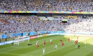 The stadium erupts as Lionel Messi (right) wheels away in celebration after his shot beats Iran’s goalkeeper Alireza Haghighi.